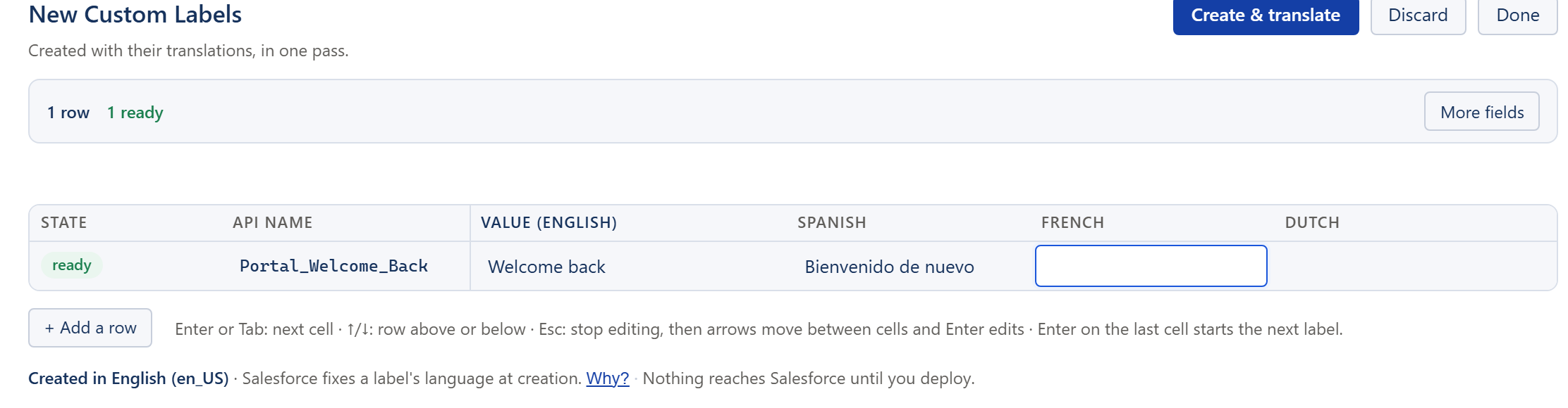 La cuadrícula de Nuevas Custom Labels con una etiqueta nombrada, su valor en inglés y su traducción al español rellenos, y una columna por cada uno de los demás idiomas de la org.